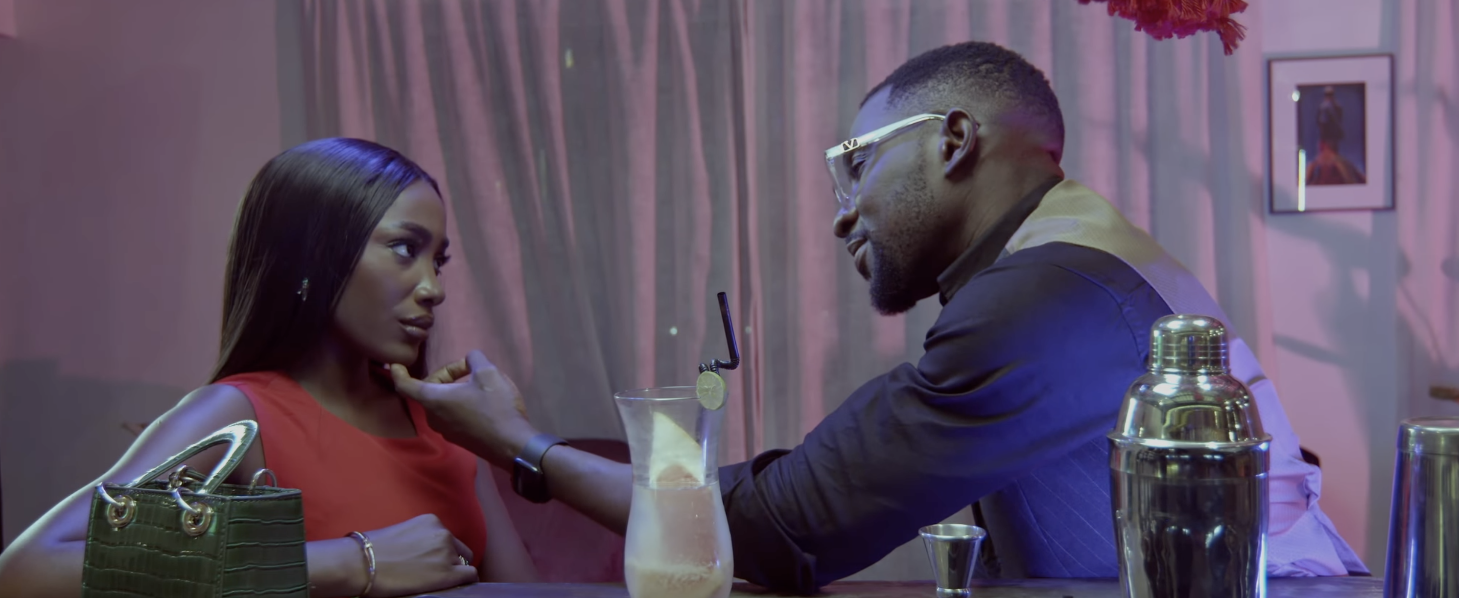 BOO'D UP (2022) - intimate bar scene with romantic lighting